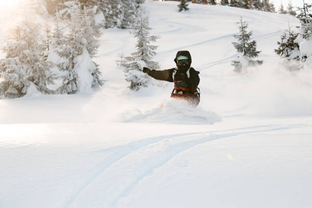 istock Female freeride snowboarder riding down the mountain snowcovered slope 1226574046