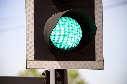 A photograph of a green road traffic light.