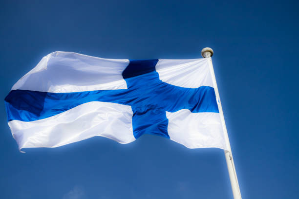 istock Finnish national flag on the wind against the blue sky 1226576966