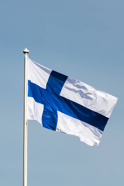 istock Finnish national flag on the wind against the blue sky 1226577004