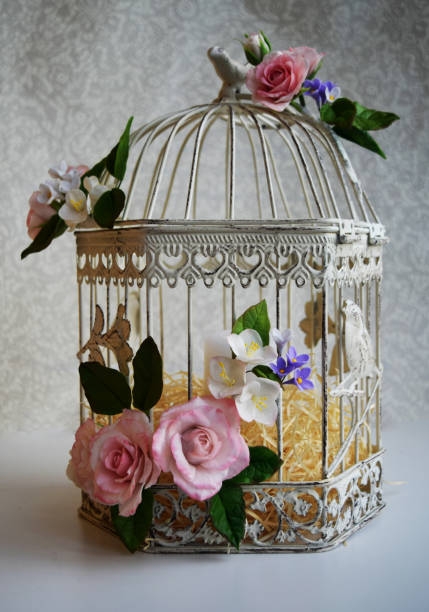 istock Bird cage with spring blossom flowers. Wedding decorations. 1226579758