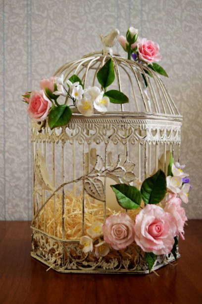 istock Bird cage with spring blossom flowers. Wedding decorations. 1226579762