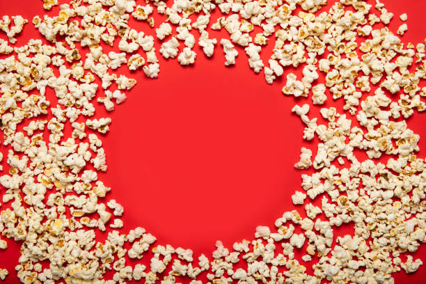 istock Delicious popcorn on a red background. View from above 1226582554