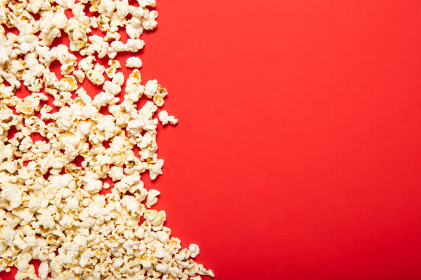 istock Delicious popcorn on a red background. Top view, place for text. 1226582701