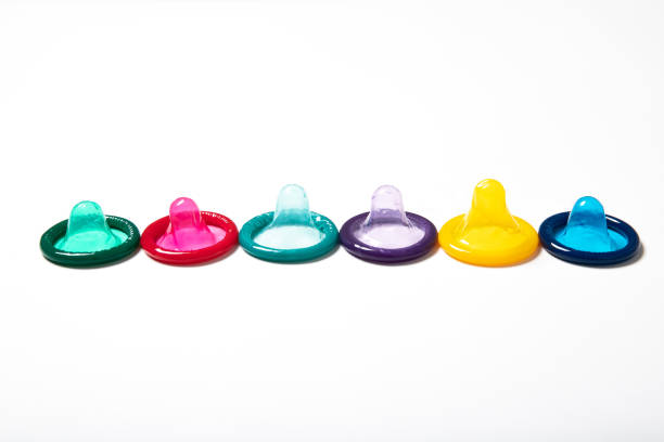 istock Multi-colored condom on a white background. Contraception. Safe sex 1226582783