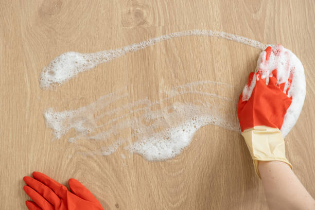istock Hands in gloves for cleaning wash surfaces with foam. 1226583668