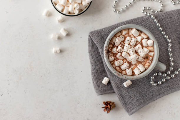 istock mug with a hot drink and mini marshmallows in a festive atmosphere. 1226583966