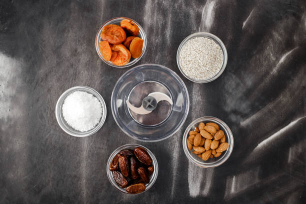 Organic sun dried fruits mix on green background. Healthy snacks instead of sugar and candy, source of vitamins and microelements. Top view