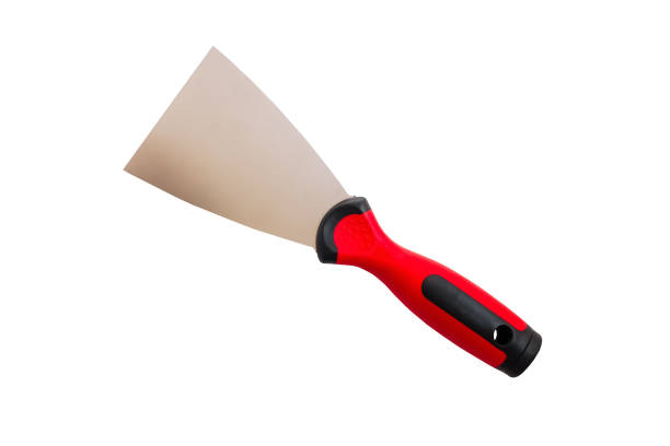 Steel trowel on a white background Steel trowel scraper with rubber handle isolated on white background. Construction putty knife, isolated on white background road scraper stock pictures, royalty-free photos & images