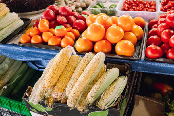 istock Organic tomatoes and corn on the counter. 1226585414