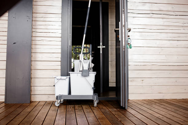 a cleaning bucket at the hotel door stock photo