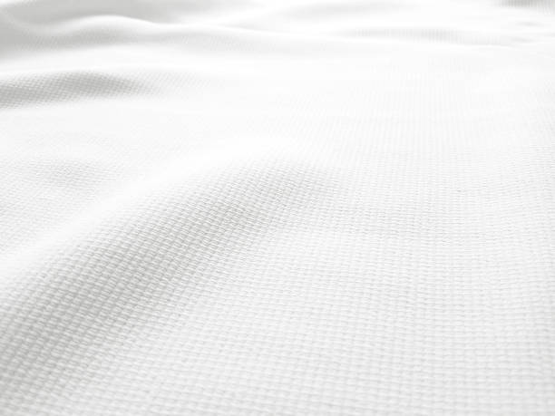 istock Soft white wrinkled fabric background for graphic design 1226586534