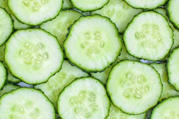 istock Fresh green slices cucumbers background 1226586701