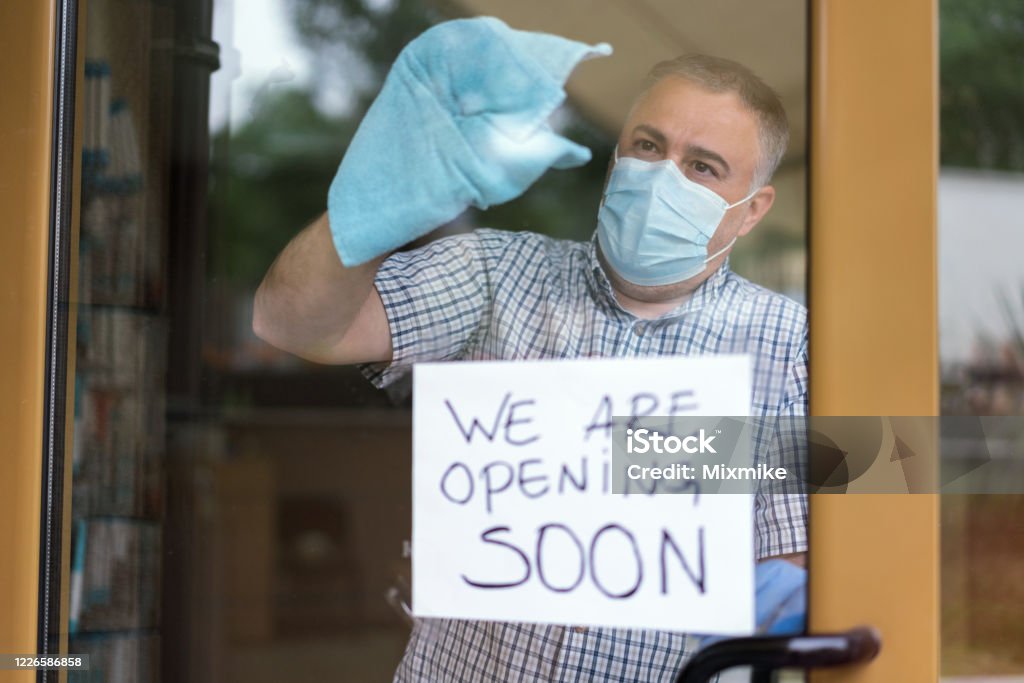 Man cleaning and disinfecting the store before reopening Small business owner cleaning and disinfecting the shop after Covid-19 quarantine Adult Stock Photo Man cleaning and disinfecting the store before reopening Small business owner cleaning and disinfecting the shop after Covid-19 quarantine Adult Stock Photo