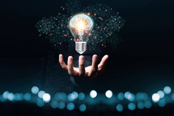 istock Hand holding the virtual light bulb with brain. Creative new business idea concept. 1226586999