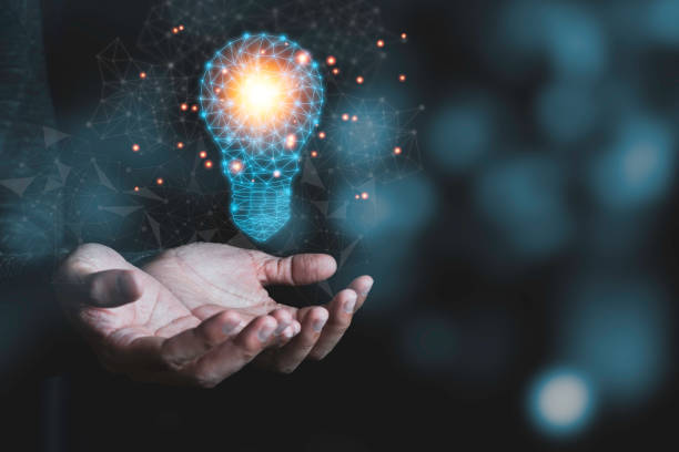 istock Hand holding the virtual light bulb with brain. Creative new business idea concept. 1226587036
