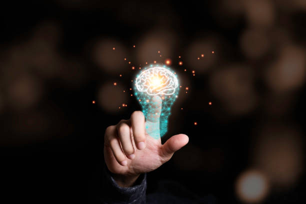 istock Hand touching the virtual light bulb with brain. Creative new business idea concept. 1226587778