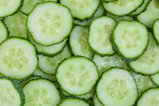 istock Fresh green slices cucumbers background 1226588101