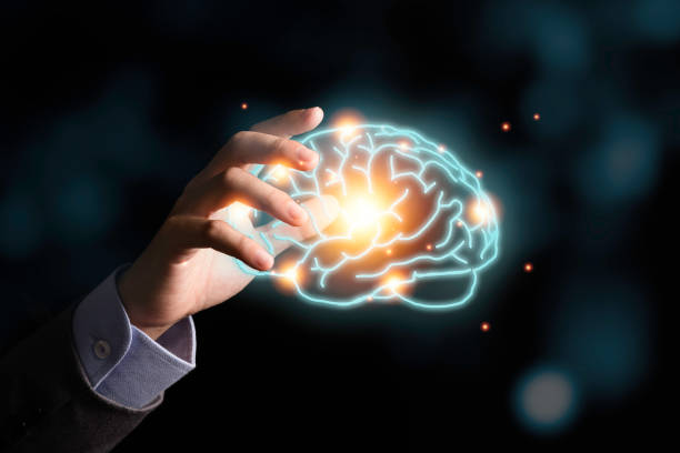 istock Businessman holding the blue virtual brain. Creative new business idea concept. 1226588125