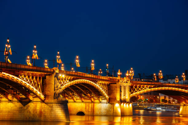 Night of Margaret Bridge with Danube river in Budapest, Hungary Night of Margaret Bridge with Danube river in Budapest, Hungary budapest danube river cruise hungary stock pictures, royalty-free photos & images