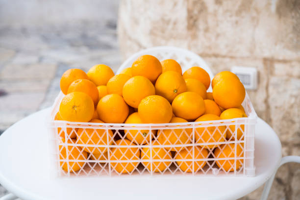 istock white plastic box full of oranges 1226589686