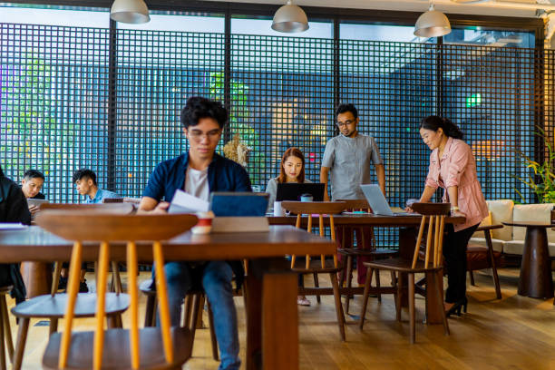 istock Asians Millennials working in busy coworking space 1226589774