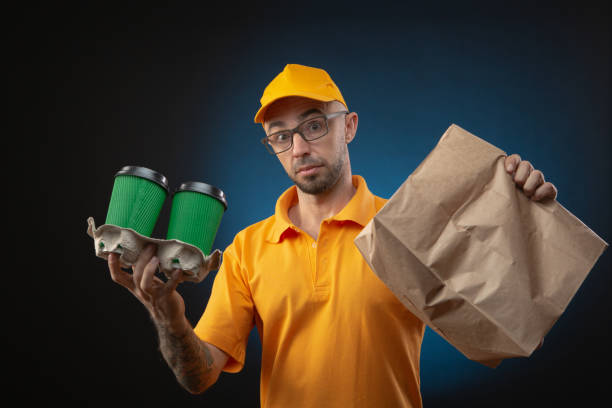 istock guy delivering packages, food, courier 1226591828