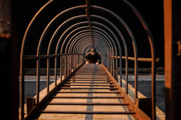 istock Top view man climbs on high metal ladder 1226592023