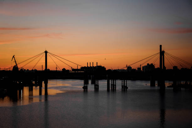 istock beautiful evening view on bridge over the river with stretched sling along which fearless highliner walks 1226592247