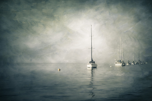 Vintage textured painterly image of sailboats in water on foggy day