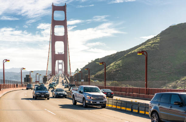 Traffic on the Golden Gate Bridge San Francisco, USA - Daytime traffic on the Golden Gate Bridge. san francisco county city california urban scene stock pictures, royalty-free photos & images