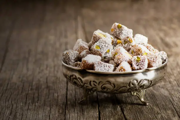 Turkish delight in hollowware, traditional turkish sweet double roasted with pistachio nuts and coconut