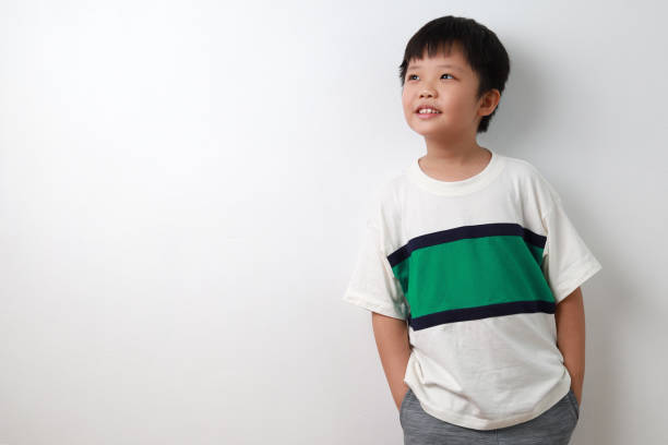 istock Boy hands in pocket standing against white background 1226611488