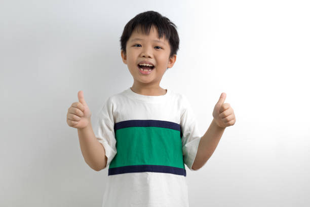 istock Happy boy showing thumbs up 1226611495
