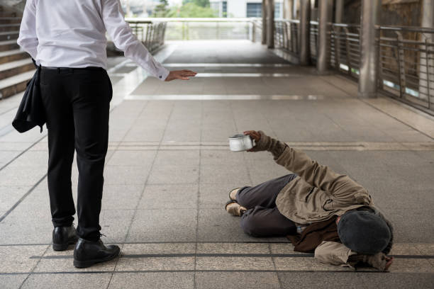 istock Businessman refuse homeless old man 1226612165
