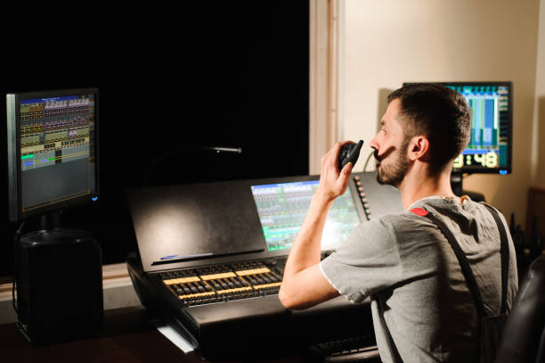 istock A lighting engineer works with lights technicians control on the concert show. Professional light mixer, mixing console. Equipment for concerts. 1226612184