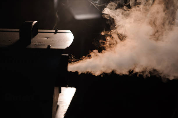 istock lights in smoke, studio lights shining through the smoke from smoke machine. 1226612228