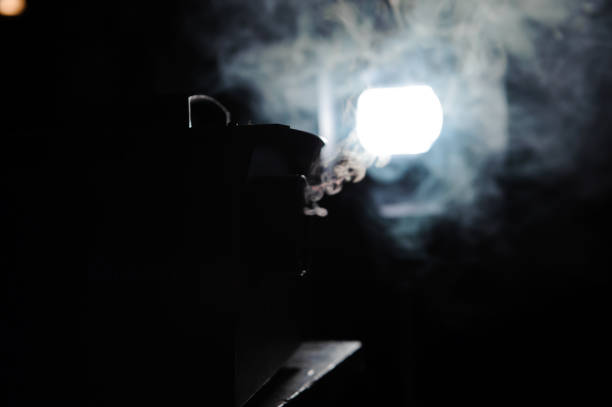 istock lights in smoke, studio lights shining through the smoke from smoke machine. 1226612231