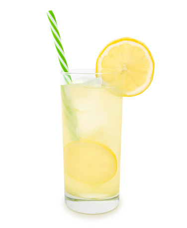 Glass of lemonade with straw and a slice of lemon isolated on white