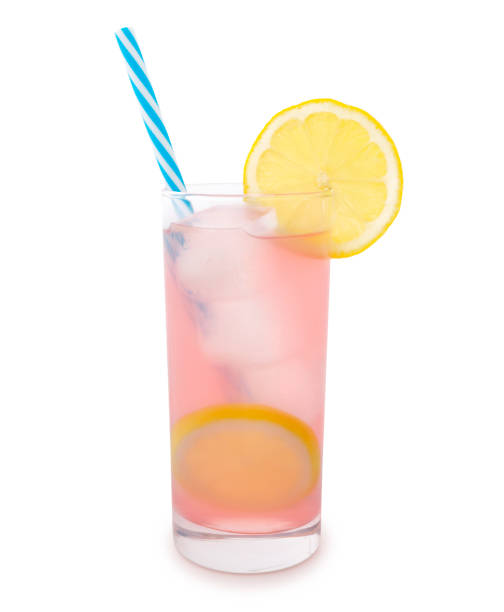 Pink Lemonade Glass of pink lemonade with straw and a slice of lemon isolated on white lemonade stock pictures, royalty-free photos & images
