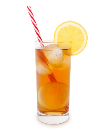 Glass of iced tea with straw and a slice of lemon isolated on white