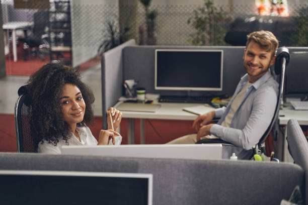 istock Two pleased young employees in their workplaces 1226613868