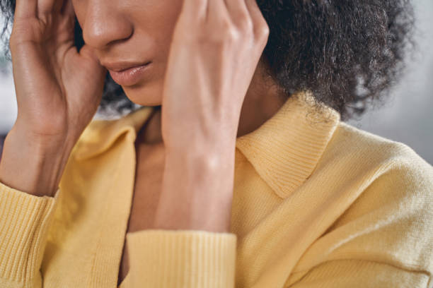 istock Dark-haired lady having a severe migraine attack 1226613908