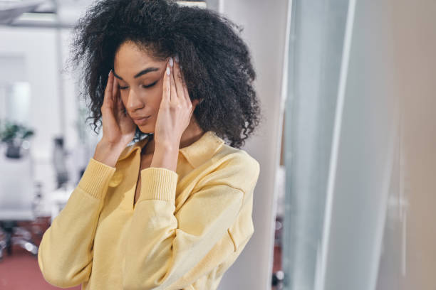 istock Young modern female employee having a headache 1226613909