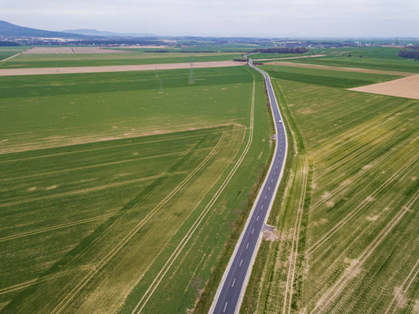 istock Aerial view on the highway between the green fields 1226616045