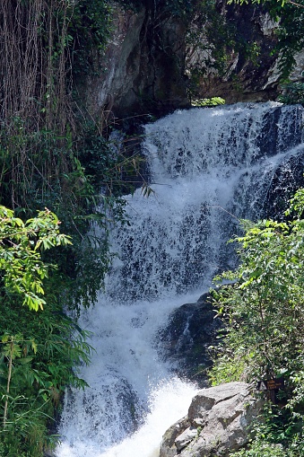 Waterfall in the decidious forest of Chiang Mai, Thailand. The mountain of Doi Suthep at west of the city of Chiang Mai.