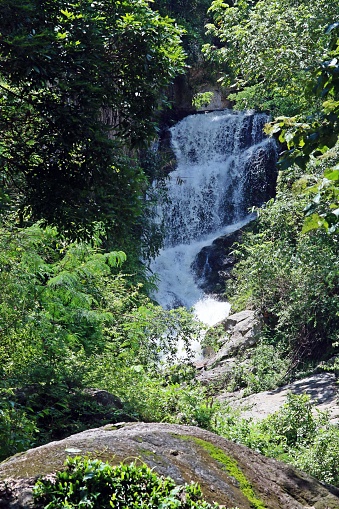 Waterfall in the decidious forest of Chiang Mai, Thailand. The mountain of Doi Suthep at west of the city of Chiang Mai.