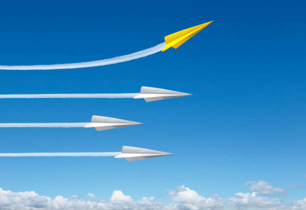 istock Yellow Paper Airplane Breaks Away From Formation 1226618361