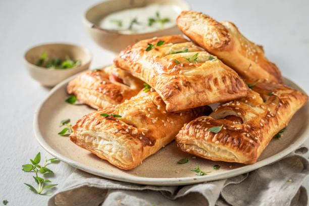 istock Crispy sausage roll with herbs and sesame seeds 1226619145