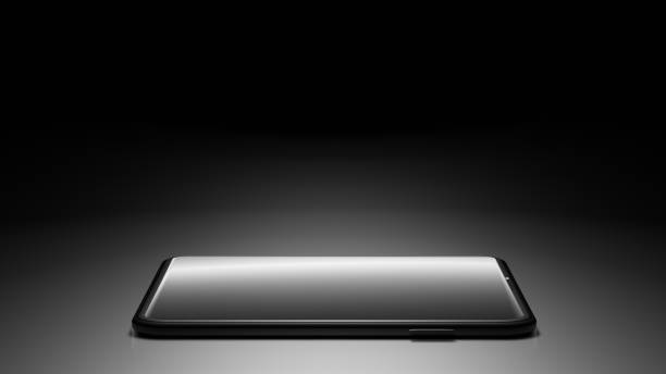 istock 8K 3D Rendered Isolated Smartphone on the Floor in the Dark Room with One Light Source and Screen turn off 1226619197